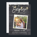 Modern Rustic Snapshot Surprise Engagement Photo S Save The Date<br><div class="desc">Modern rustic fun photo engagement announcement with your photo in a square frame on a dark wooden backdrop with string lights and a hand lettered script reading SURPRISE! We got engaged! Space for details like date for a save the date,  wedding website etc on the front and back.</div>