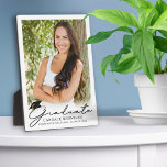 Modern Script Graduate Photo Keepsake Plaque<br><div class="desc">Simple DIY design with easy upload of your graduate's photo on this easel-back plaque featuring a modern, stylish script title GRADUATE accented with a black graduation cap and personalized with your graduate's name, school or college and class year. PHOTO TIP: Choose a photo with the subject in the middle and/or...</div>