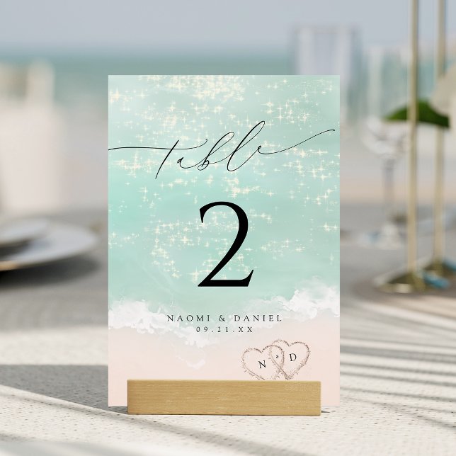 Modern Script Hearts In The Sand Beach Wedding  Table Number (Modern Script Hearts In The Sand Beach Wedding Table Number)