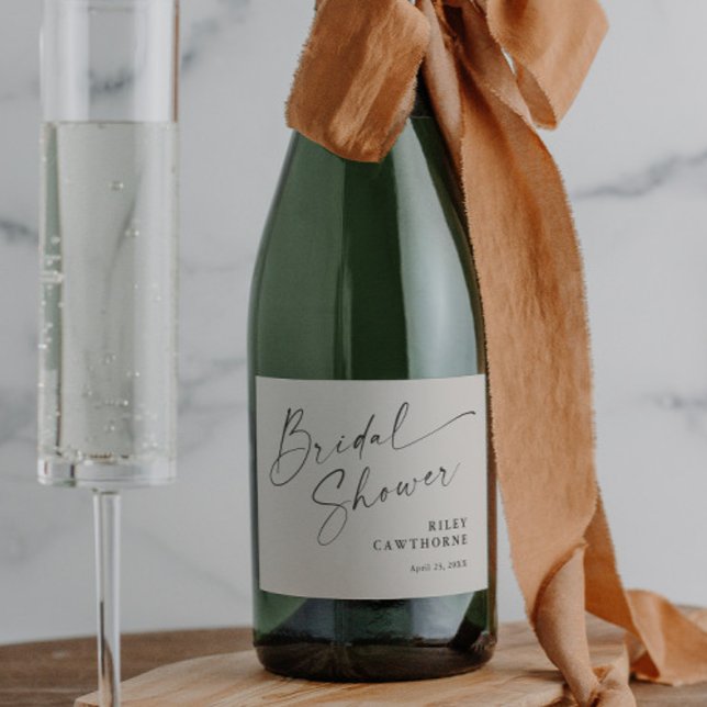 Modern Script Ivory Boho Bridal Shower Sparkling Wine Label (Modern script boho bridal shower sparkling wine label.)