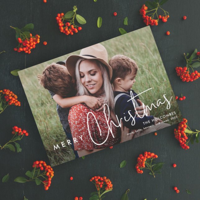 Modern Script Merry Christmas Simple Photo Holiday Card (Modern Script Merry Christmas Photo Holiday Card with Handwritten Typographic Overlay.)
