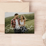 Modern script navy save the date photo card<br><div class="desc">With a single horizontal photo and a modern script written "save the date, " this card is the perfect way to announce your engagement and upcoming wedding to friends and family. The white text is bold and modern but still sophisticated. The customizable text on the front has room for names,...</div>