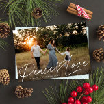 Modern Script Peace Heart Love Christmas One Photo Holiday Card<br><div class="desc">This sweet holiday photo card features a full-bleed horizontal photo with the greeting "Peace Love". This design accommodates one horizontal photo. ALL of the colours are fully customizable, including the greeting and heart - just click on "edit using design tool" in the personalization dropdown menu! You can customize this design...</div>