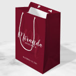 Modern Script Personalized Bridesmaid Burgundy Red Medium Gift Bag<br><div class="desc">Personalized Bridesmaids Gift Bag featuring personalized bridesmaid's name in white modern script font style and monogram in light burgundy red modern script font style as background with title and wedding date in white modern sans serif font style on burgundy red background. Also perfect for groomsman, best man, ring bearer, father...</div>