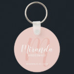 Modern Script Personalized Bridesmaid Keychain<br><div class="desc">Add a personal touch to your wedding with personalized bridesmaid keychain. This keychain features personalized bridesmaid's name in white modern script font style and monogram in blush pink modern script font style as background with title and wedding date in white modern sans serif font style on blush pink background. Also...</div>