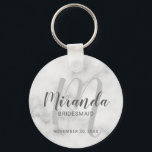 Modern Script Personalized Bridesmaid Keychain<br><div class="desc">Add a personal touch to your wedding with personalized bridesmaid keychain. This keychain features personalized bridesmaid's name in grey modern script font style and monogram in light grey modern script font style as background with title and wedding date in grey modern sans serif font style on white marble background. Also...</div>