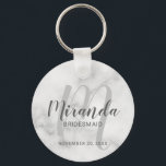 Modern Script Personalized Bridesmaid Keychain<br><div class="desc">Add a personal touch to your wedding with personalized bridesmaid keychain. This keychain features personalized bridesmaid's name in grey modern script font style and monogram in light grey modern script font style as background with title and wedding date in grey modern sans serif font style on white marble background. Also...</div>