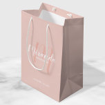 Modern Script Personalized Bridesmaids Medium Gift Bag<br><div class="desc">Personalized Bridesmaids Gift Bag featuring personalized bridesmaid's name in white modern script font style and monogram in blush pink modern script font style as background with title and wedding date in white modern sans serif font style on blush pink background. Also perfect for maid of honour, flower girl, mother of...</div>