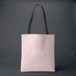 Modern Script Personalized Bridesmaids Tote Bag<br><div class="desc">Modern Script Personalized Bridesmaids Tote Bag
featuring personalized bridesmaid's name in white modern script font style with title and wedding date in modern sans serif font style on blush pink background.

Also perfect for Maid of Honour,  Flower Girl,  Mother of the Bride and more.</div>