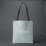 Modern Script Personalized Bridesmaids Tote Bag<br><div class="desc">Modern Script Personalized Bridesmaids Tote Bag
featuring personalized bridesmaid's name in white modern script font style with title and wedding date in modern sans serif font style on sage green background.

Also perfect for Maid of Honour,  Flower Girl,  Mother of the Bride and more.</div>