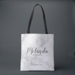 Modern Script Personalized Bridesmaids Tote Bag<br><div class="desc">Modern Script Personalized Bridesmaids Tote Bag
featuring personalized bridesmaid's name in grey modern script font style with title and wedding date in modern sans serif font style on white marble background.

Also perfect for Maid of Honour,  Flower Girl,  Mother of the Bride and more.</div>