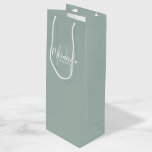 Modern Script Personalized Bridesmaids Wine Gift Bag<br><div class="desc">Personalized Bridesmaids Gift Bag featuring personalized bridesmaid's name in white modern script font style and monogram in sage green modern script font style as background with title and wedding date in white modern sans serif font style on sage green background. Also perfect for maid of honour, flower girl, mother of...</div>