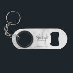 Modern Script Personalized Groomsman Keychain Bottle Opener<br><div class="desc">Add a personal touch to your wedding with personalized groomsman gift. This design features personalized groomsman's name in grey modern script font style and monogram in light grey modern script font style as background with title and wedding date in grey modern sans serif font style on white marble background. Also...</div>
