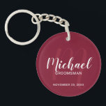 Modern Script Personalized Groomsmen Monogram&Name Keychain<br><div class="desc">Add a personal touch to your wedding with personalized groomsmen keychain. This keychain features personalized groomsmen's name in white modern script font style and monogram in light burgundy red modern script font style as background with title and wedding date in white modern sans serif font style on burgundy red background....</div>