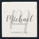 Modern Script Personalized Groomsmen Stone Coaster<br><div class="desc">Add a personal touch to your wedding with personalized groomsmen stone coaster. This coaster features personalized groomsmen's name in grey modern script font style and monogram in light grey modern script font style as background with title and wedding date in grey modern sans serif font style. Also perfect for best...</div>