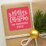Modern Script Red Merry Christmas Custom Square Sticker<br><div class="desc">Stylish Merry Christmas holiday favour sticker features white script writing and accents of branches with holly leaves and berries. Personalize with custom name / family and year text. The crimson red background colour can be modified.</div>