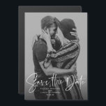 Modern script vertical photo save the date magnetic invitation<br><div class="desc">With a single vertical photo and a modern script written "save the date, " this magnetic card is the perfect way to announce your engagement and upcoming wedding to friends and family. The white text is bold and modern but still sophisticated. The customizable text has room for names, date, location...</div>