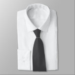 Modern Solid Minimal Dark Grey White Monogram Tie<br><div class="desc">Elevate your wardrobe with our Modern Solid Black Neck Tie, a timeless accessory designed to add a touch of sophistication to any ensemble. Crafted with precision and attention to detail, this neck tie features a rich black hue that exudes elegance and makes a refined statement. The customizable option allows you...</div>