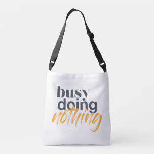 Modern, trendy, urban design of Busy Doing Nothing Crossbody Bag