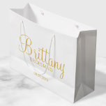 Modern White and Gold Personalized Bridesmaids Large Gift Bag<br><div class="desc">Modern White and Gold Personalized Bridesmaids Gifts featuring personalized bridesmaid's name in gold modern script font style with title and wedding date in gold modern sans serif font style. Also perfect for Maid of Honour, Flower Girl, Mother of the Bride and more. Please Note: The foil details are simulated in...</div>