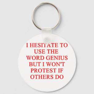 modest genius joke keychain
