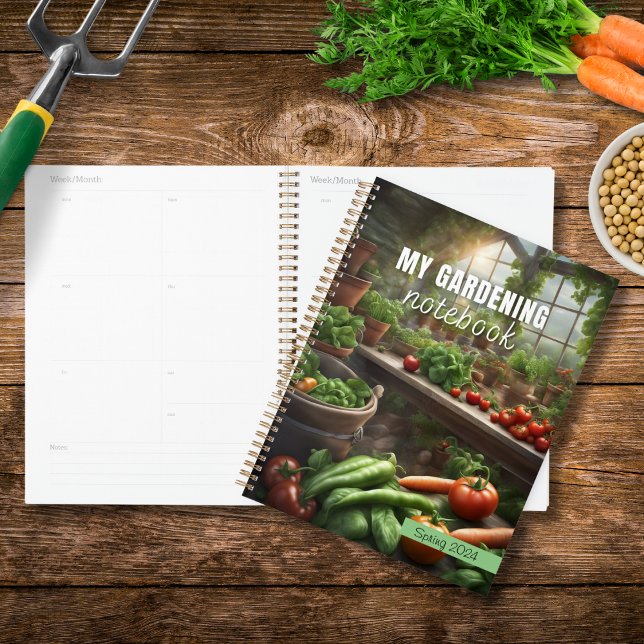 Mon journal de planification du Carnet de jardinag (A planner - My Gardening Notebook - on a wooden table with vegetables and gardening objects)