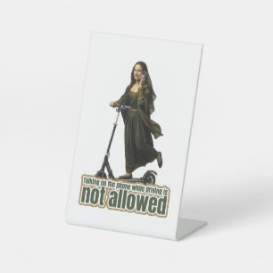 Mona Lisa on the phone  riding a kick scooter Pedestal Sign