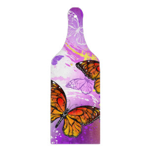Monarch Butterflies on Purple Background Cutting Board