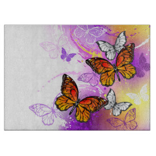 Monarch Butterflies on Purple Background Cutting Board