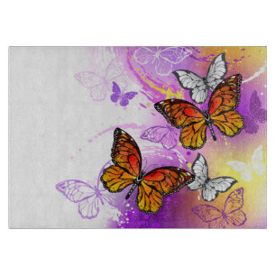 Monarch Butterflies on Purple Background Cutting Board
