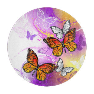 Monarch Butterflies on Purple Background Cutting Board