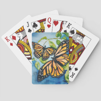 Monarch butterflies playing cards