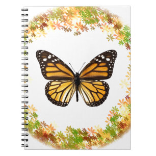 Monarch butterfly in frame of leaves notebook