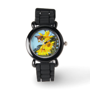 Monarque papillon sur tournesol montres