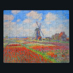 Monet Tulips Windmill Jigsaw Puzzle<br><div class="desc">Puzzle featuring Claude Monet’s flower and windmill painting. Beautiful and colorful fields of red,  pink,  and yellow tulips next to a windmill and house in Holland. A great Monet gift for fans of impressionism and French art.</div>