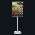 Monet's Garden at Argenteuil by Claude Monet Table Lamp<br><div class="desc">The Artist's Garden in Argenteuil (A Corner of the Garden with Dahlias) (1873) by Claude Monet is a vintage impressionism fine art floral nature painting. A country farm house is in the background. A couple in love is walking past a romantic spring season garden with blooming roses and other flowers....</div>