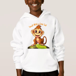 Monkey assis sur un T-shirt à feuille verte et à c