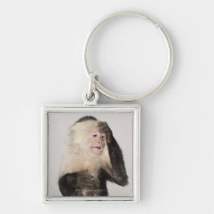 Monkey scratching itself keychain