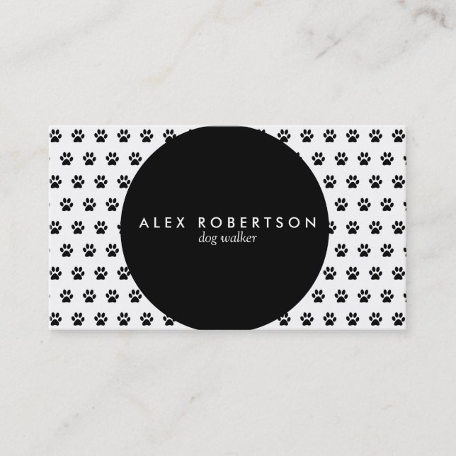 Monochrome black circle and white paw print business card (Front)