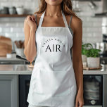 Monogram Black Minimal Apron<br><div class="desc">Elevate your kitchen style with this Monogram Black Minimalist Apron. Featuring a sleek and simple design, this apron combines functionality with elegance, making it perfect for both home cooks and professional chefs. The customizable monogram adds a personal touch, ensuring that you cook in style. Made from durable materials, this apron...</div>