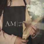 Monogram Black Minimal Apron<br><div class="desc">Elevate your kitchen style with this Monogram Black Minimalist Apron. Featuring a sleek and simple design, this apron combines functionality with elegance, making it perfect for both home cooks and professional chefs. The customizable monogram adds a personal touch, ensuring that you cook in style. Made from durable materials, this apron...</div>