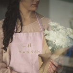 Monogram Blush Pink | Elegant Gold Minimalist Apron<br><div class="desc">A simple stylish custom monogram design in a gold modern minimalist typography on an elegant pastel blush pink background. The monogram initials and name can easily be personalized along with the feature line to make a design as unique as you are! The perfect bespoke gift or accessory for any occasion....</div>