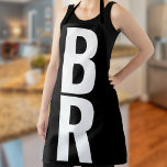 Monogram Bold Modern Black Apron<br><div class="desc">Introducing our personalized masterpiece, the Monogrammed Maven Apron, where function meets fashion. Elevate your culinary adventures with this exquisitely designed apron adorned with a bold and oversized monogram. Your kitchen is your castle, and you are the reigning chef deserving of an apron that's as unique and bold as your recipes....</div>