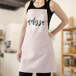 Monogram Brush Calligraphy Blush Pink Apron<br><div class="desc">In the realm of culinary arts, individuality and style are as significant as the flavours you create. Our personalized apron, adorned with a tastefully designed monogram and your name, serves as an emblem of your unique culinary identity. The font duo—comprising an elegant serif font for the monogram and a modern...</div>