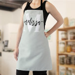 Monogram Brush Calligraphy Sage Green Apron<br><div class="desc">In the realm of culinary arts, individuality and style are as significant as the flavours you create. Our personalized apron, adorned with a tastefully designed monogram and your name, serves as an emblem of your unique culinary identity. The font duo—comprising an elegant serif font for the monogram and a modern...</div>