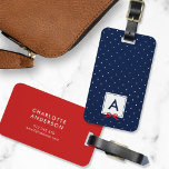 Monogram Chic Red Ribbon Polka Dot Blue Luggage Tag<br><div class="desc">Travel in style with this chic monogram luggage tag featuring a blue bordered square with a red ribbon against a blue and white polka dot pattern. Personalize it by replacing the placeholder text. For more options such as to change the font and it's size/colour or the spacing between letters click...</div>