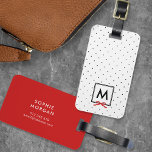 Monogram Chic Red Ribbon Polka Dot Luggage Tag<br><div class="desc">Travel in style with this chic monogram luggage tag featuring a black bordered square with a red ribbon against a black and white polka dot pattern. Personalize it by replacing the placeholder text. For more options such as to change the font and it's size/colour or the spacing between letters click...</div>