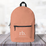 Monogram Coral Peach Elegant Feminine Minimalist Printed Backpack<br><div class="desc">A minimalist monogram design with large typography initials in a classic font with your name below on a feminine coral peach background. The perfectly custom gift or accessory!</div>