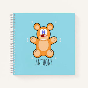 Monogram cute brown teddy bear on blue notebook