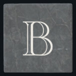 Monogram Elegant Black Stone Texture Stone Coaster<br><div class="desc">An elegant looking black marbled stone texture. Cuts,  scrapes,  scarring and random marks give it depth and personality. Personalize with your initial / monogram in a bold white font.</div>